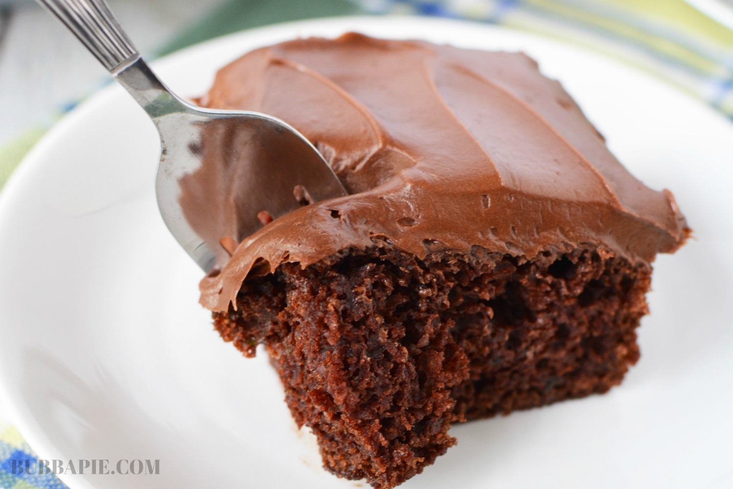 Chocolate Zucchini Cake Recipe is made with shredded vegetables and greek yogurt for a very moist cake.