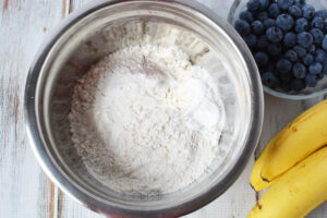 Combine flour and baking soda for banana blueberry muffins