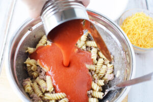 Combine pasta sauce to make beefaroni