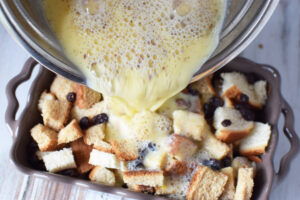 Pour egg mixture over bread pudding