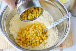 add corn to corn mix and sugar.