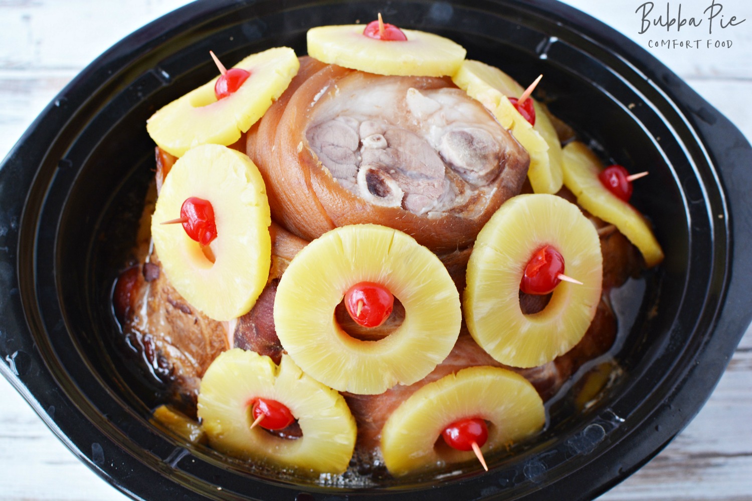 Slow Cooker Ham with Pineapple sitting in a crock pot for Easter Dinner