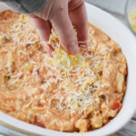 Topping Dorito Casserole with cheese