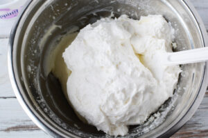 Fold in whipped topping to cream cheese and sugar