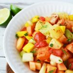 Mexican Fruit Salad is made with tropical fruit and a chili lime sauce