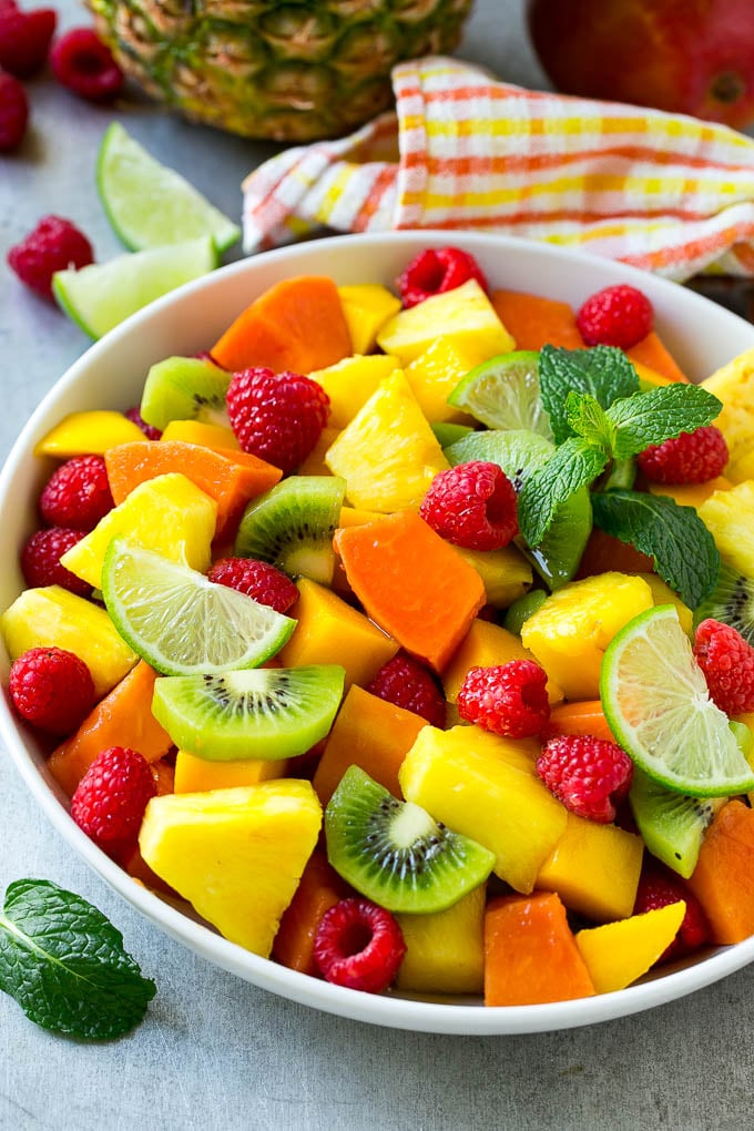 tropical fruit salad is made with mangoes and kiwi