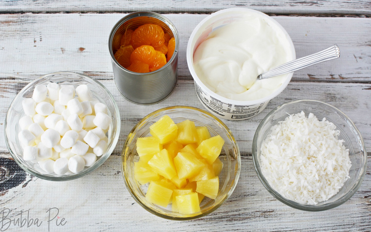 Ingredients for a Marshmallow Fruit Salad include pineapple, oranges, coconut and sour cream