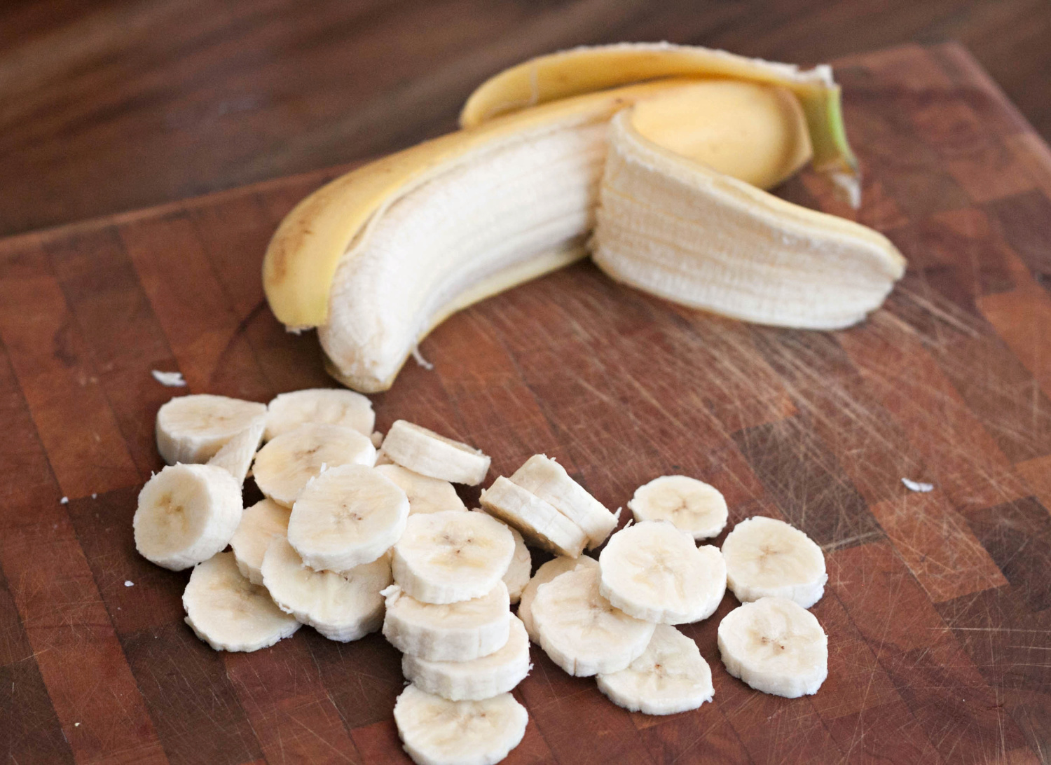 Fresh banana being sliced for Banana Cream Pie recipe