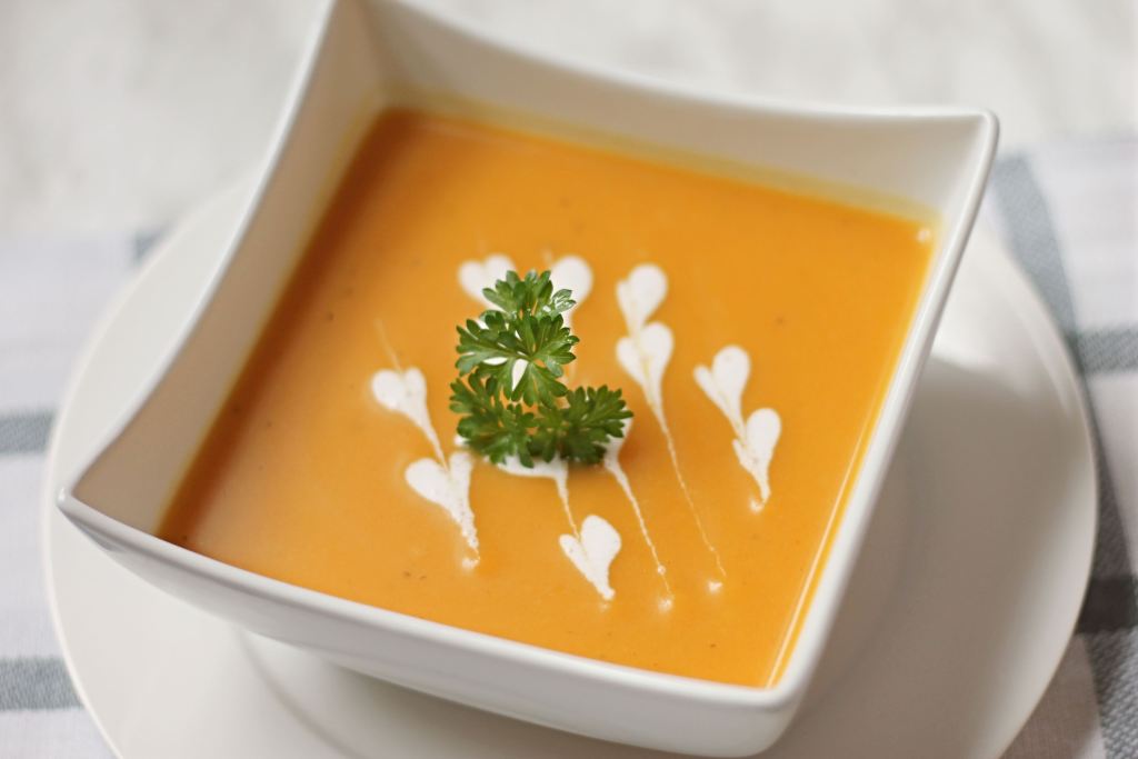 Butternut squash soup sitting in a bowl on the table