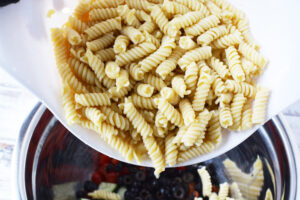 Cook pasta and rinse with cold water