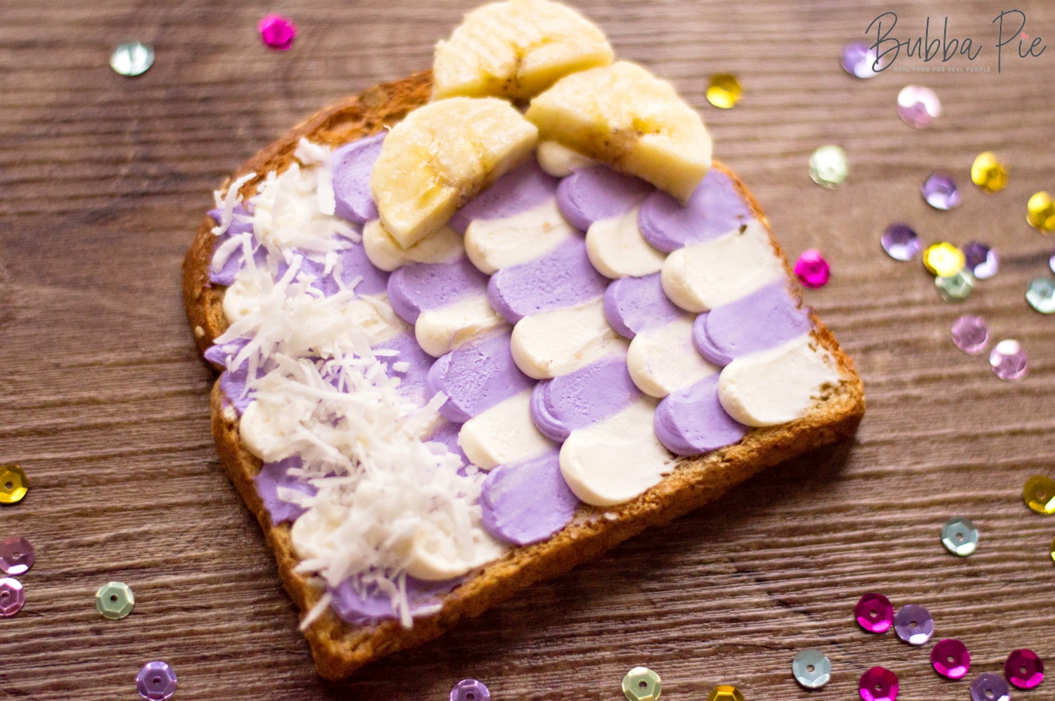 Easy Mermaid Toast Recipe with white and violet cream cheese with coconut and banana