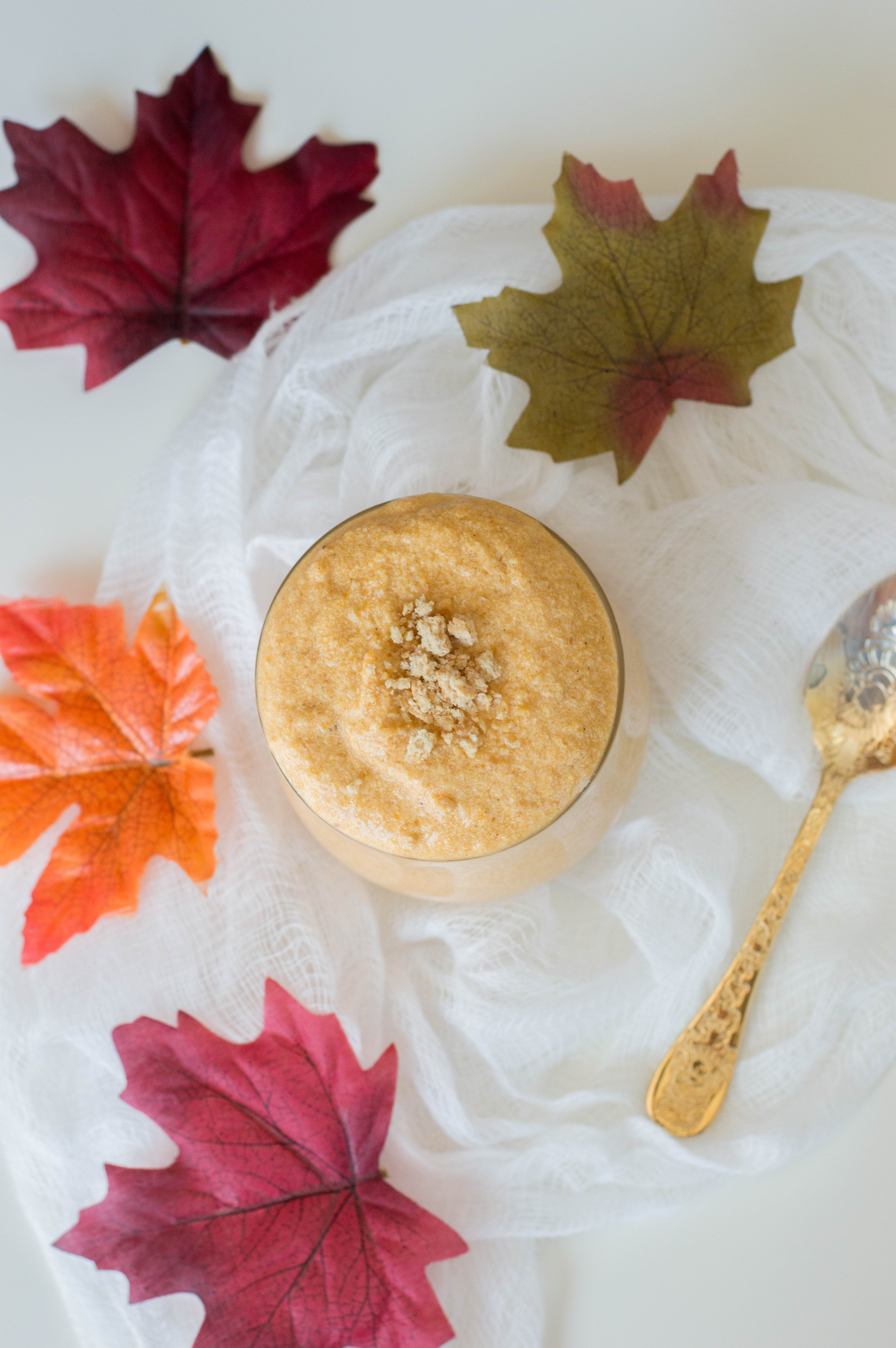 Easy Pumpkin Mousse recipe sitting on a table with Autumn decorations