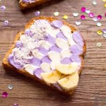 Mermaid Toast sitting on a table with decorative sprinkles and confetti