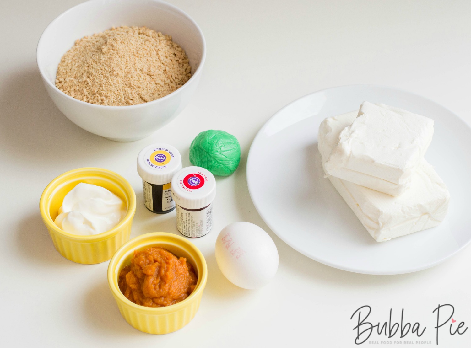 Pumpkin Cheesecake Bites ingredients include eggs, cream cheese, sugar, graham crackers and butter.