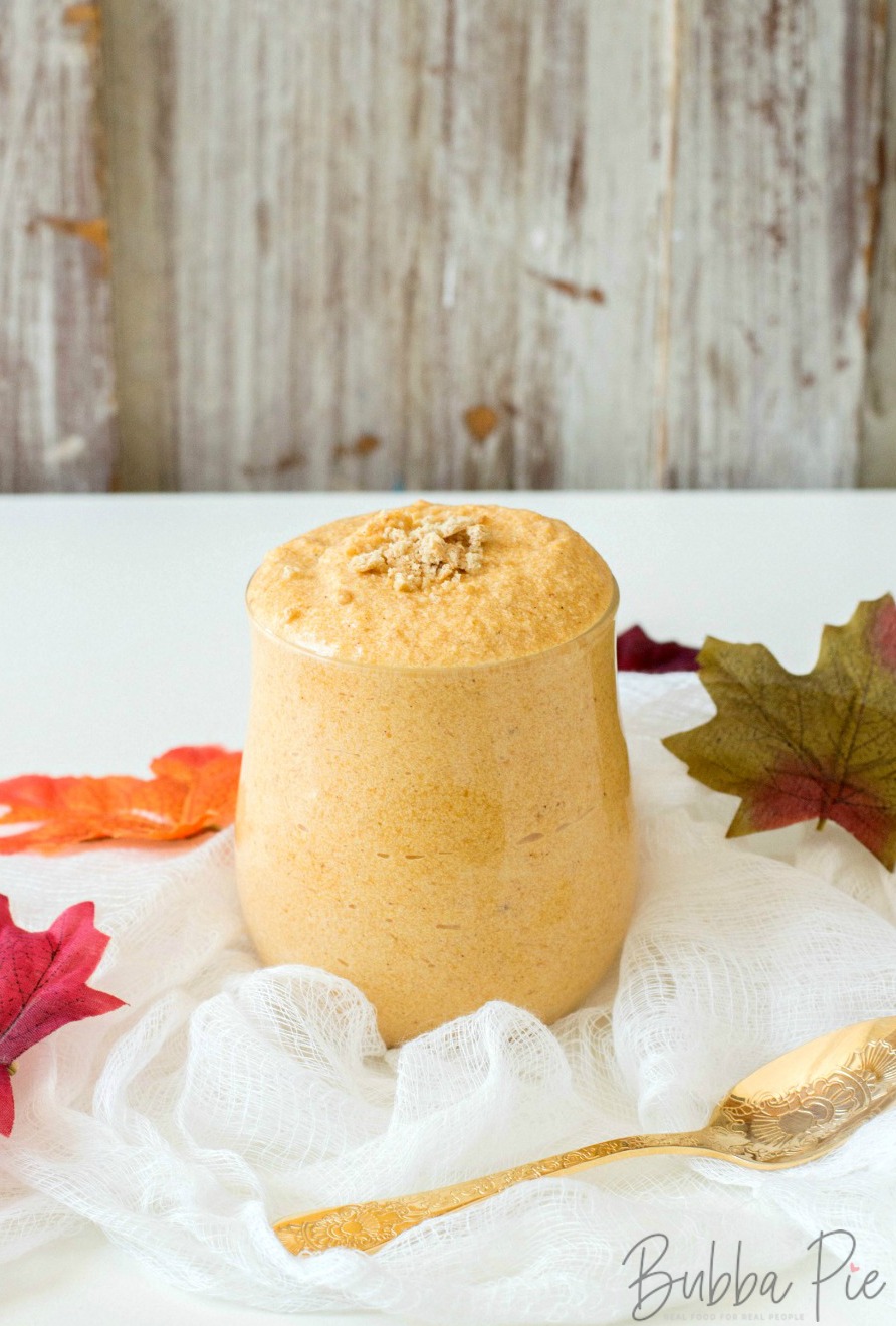 Pumpkin Mousse Recipe sitting with a spoon and Fall decorations