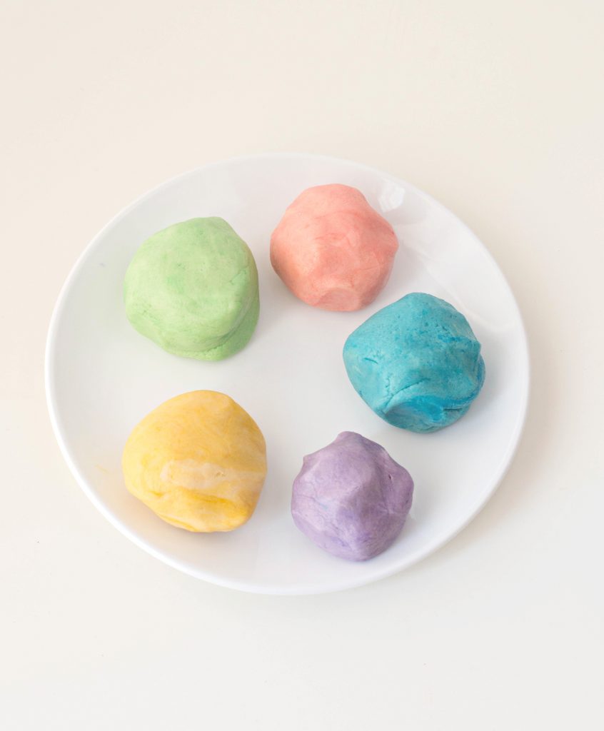 Rainbow Sugar Cookies Recipe includes adding food coloring to different balls of sugar cookie dough. 