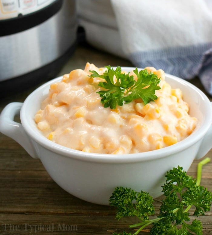 instant pot creamed corn sitting on the thanksgiving table