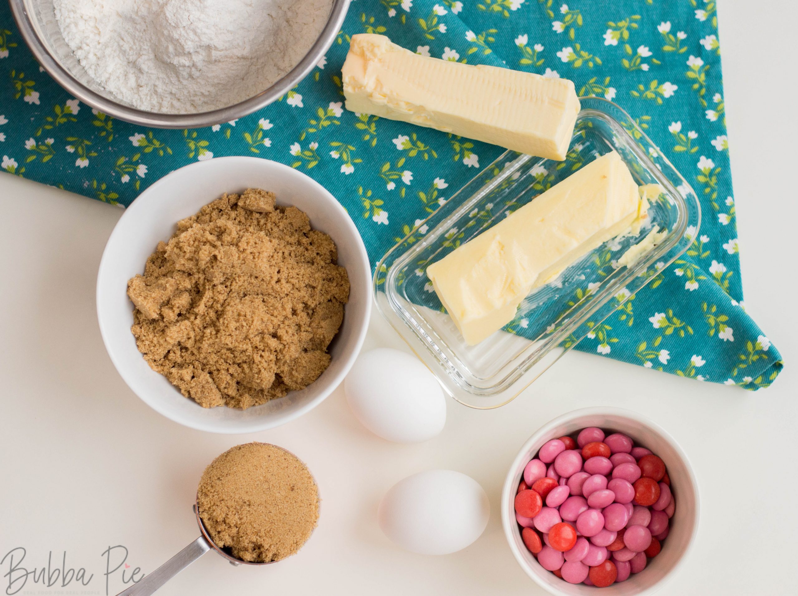 Valentine's Day Brown Sugar Blondie ingredients include butter, sugar, eggs, flour and m&ms