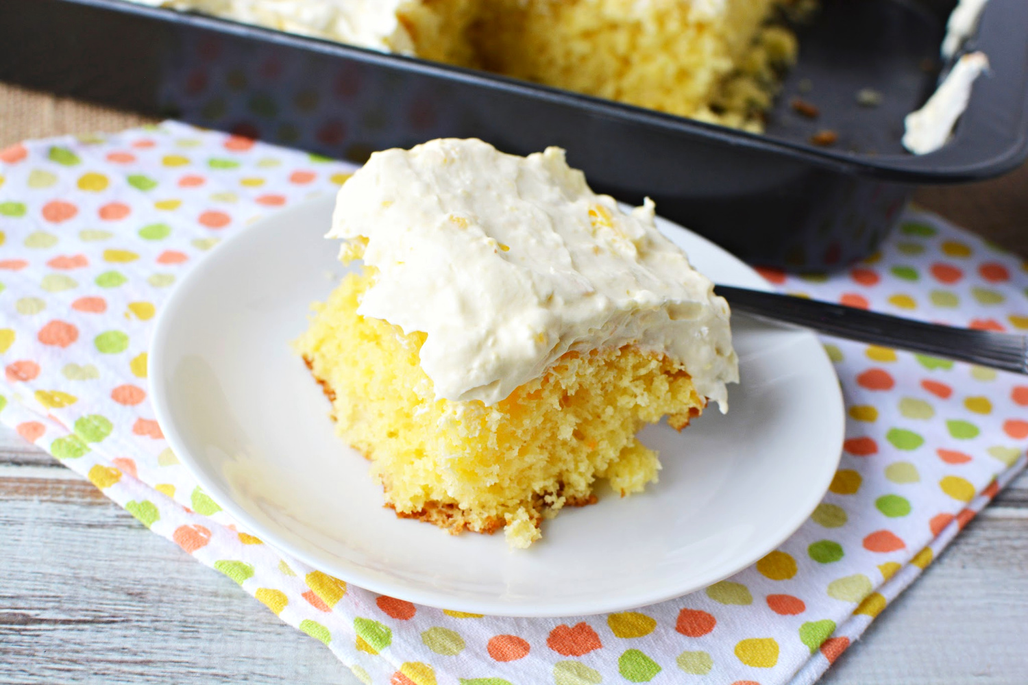 Easy Pineapple Sunshine Cake is made with whipped cream, yellow cake mix and pineapples