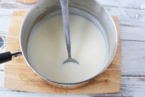 Stir Milk and butter for au gratin