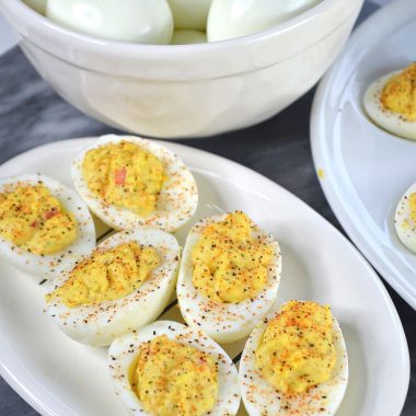 easy cajun deviled eggs being served on a white plate