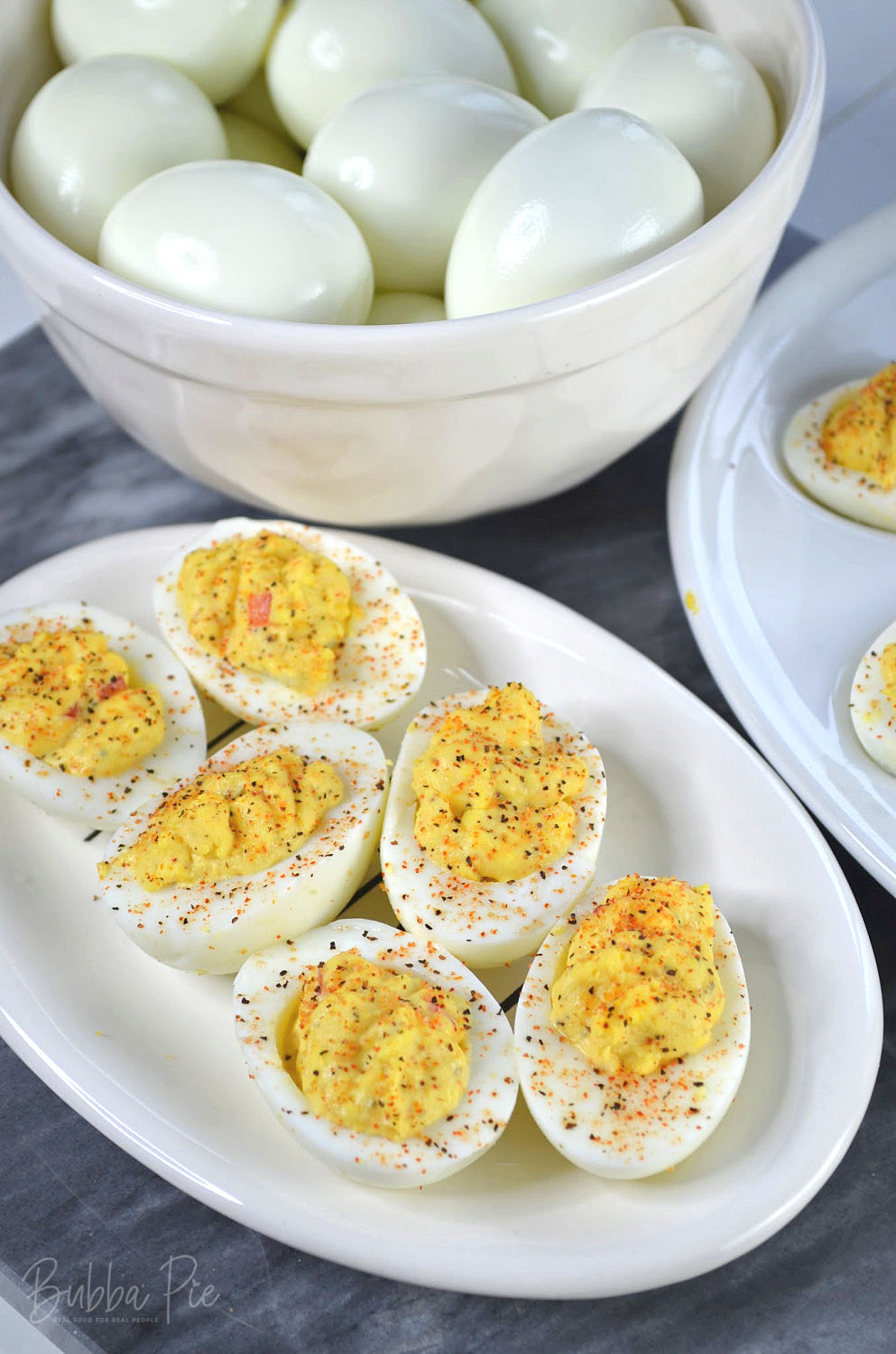 easy cajun deviled eggs being served on a white plate