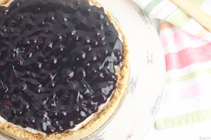 Before serving, spread the blueberry pie filling over the top of the cheesecake.