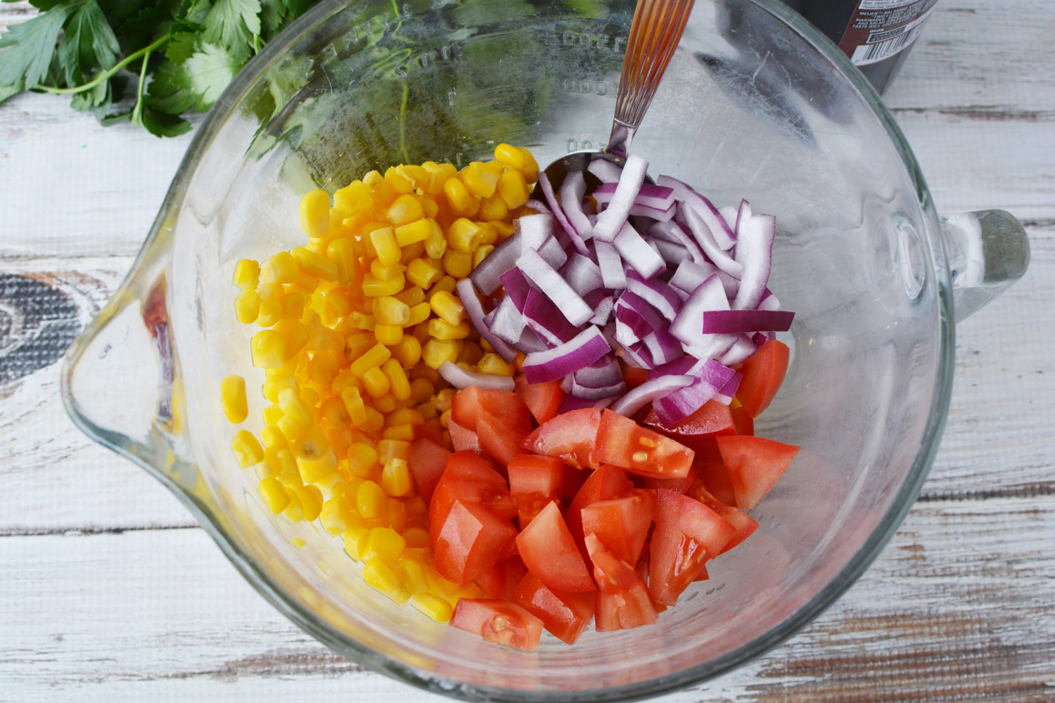 Corn and Tomato Salad instructions include red onion, parsley and olive oil.