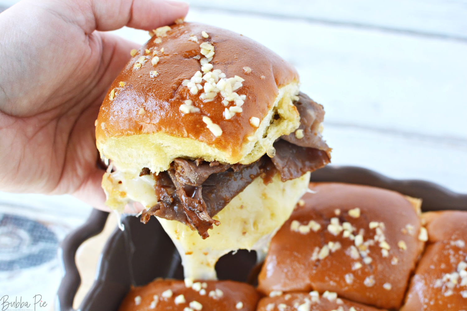 French Dip Sliders Recipe is made with roast beef, provolone cheese and caramelized onions. 