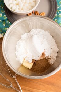 mix together butter, confectioners’ sugar, cocoa powder and milk
