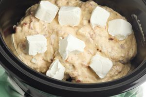 Put chicken, soup mixture and cubed cream cheese in crock pot.