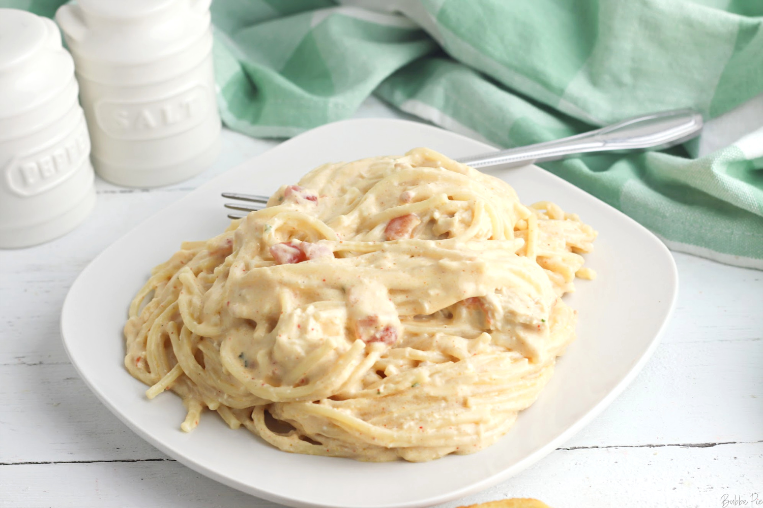 Crockpot Chicken Spaghetti is cheesy and slightly spicy.