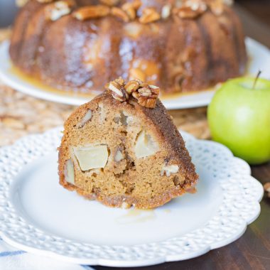 A slice of Apple Dapple Bundt Cake being served for the Holidays.