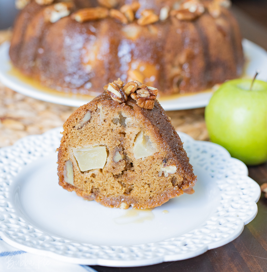 A slice of Apple Dapple Bundt Cake being served for the Holidays.