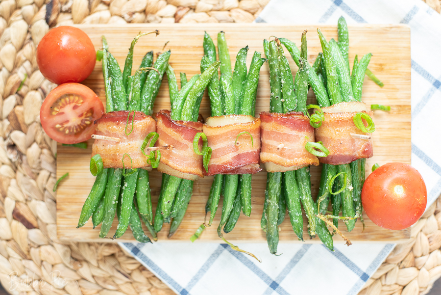 Bacon Wrapped Green Bean Bundles with a maple glaze being served for Thanksgiving.