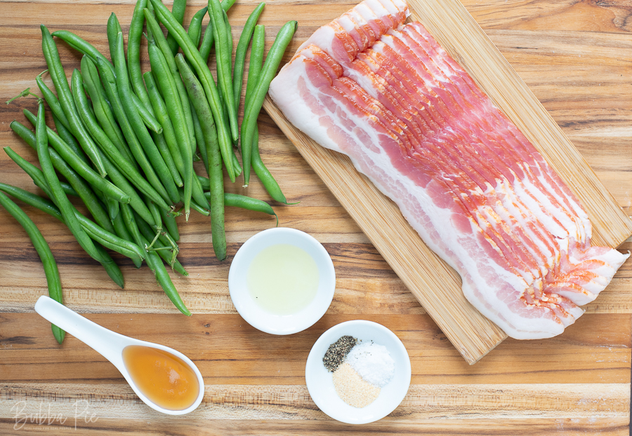 Bacon Wrapped Green Beans Ingredients include garlic powder, salt and maple syrup.