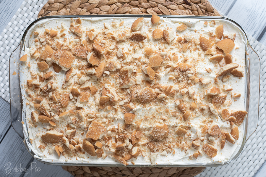 Banana Pudding Poke Cake topped with vanilla wafers