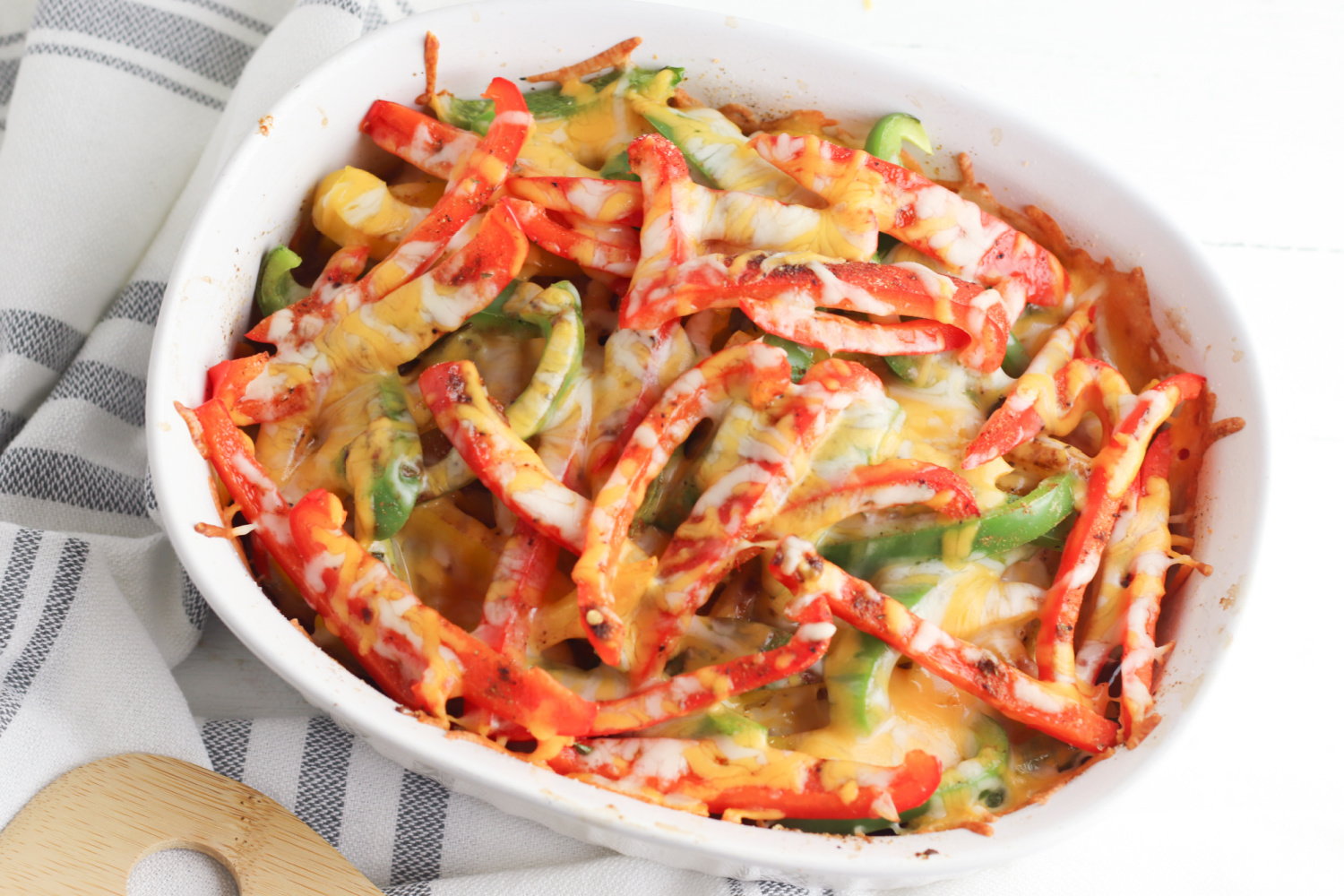 Chicken Fajita Casserole Recipe being served for dinner in a white dish. 