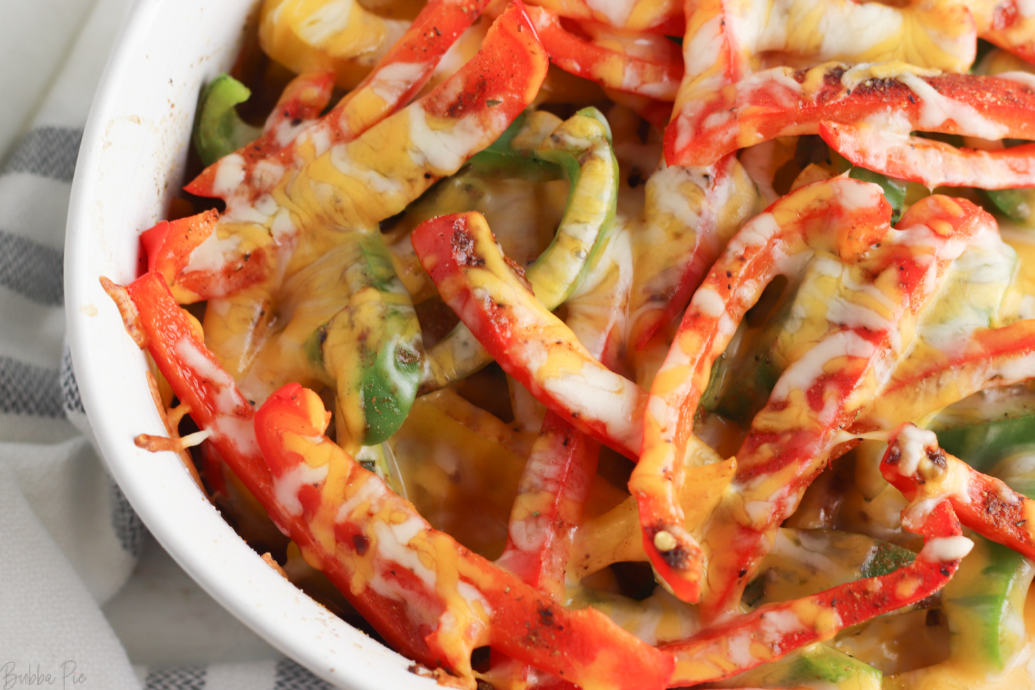 Chicken Fajita Casserole made with shredded cheese, onions and bell peppers. 