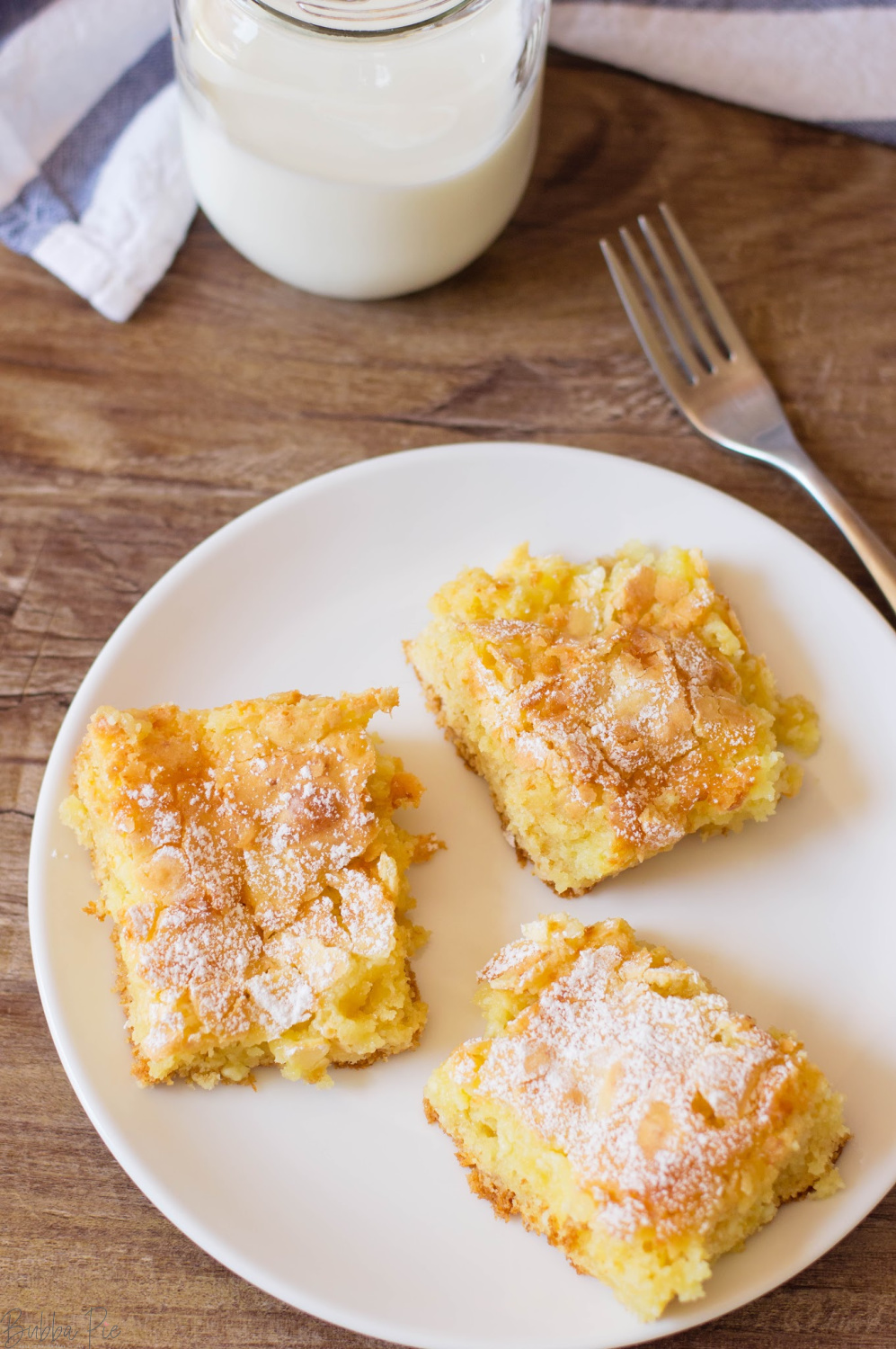 Ooey Gooey Butter Cake Recipe being served for dessert. 