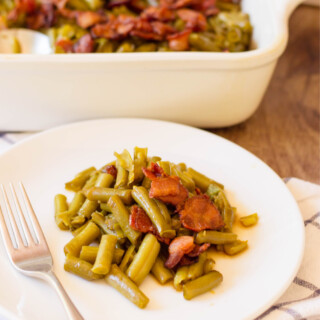Arkansas Green Beans Recipe being served as a side dish on a white plate.