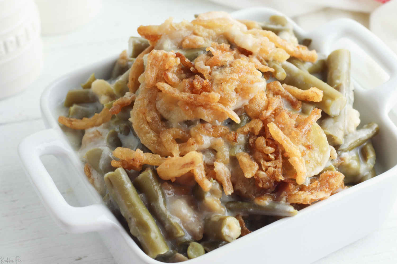 Crockpot Green Bean Casserole being served as a holiday side dish. 