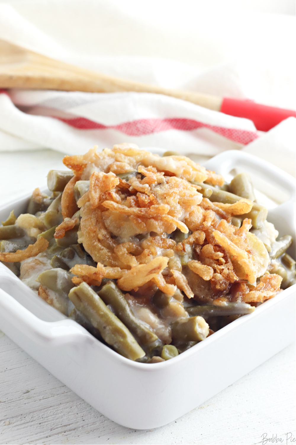 Making Green Bean Casserole in Crock Pot and topping with Crispy Onions.