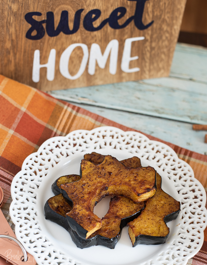 Maple Roasted Acorn Squash on a dinner plate. 