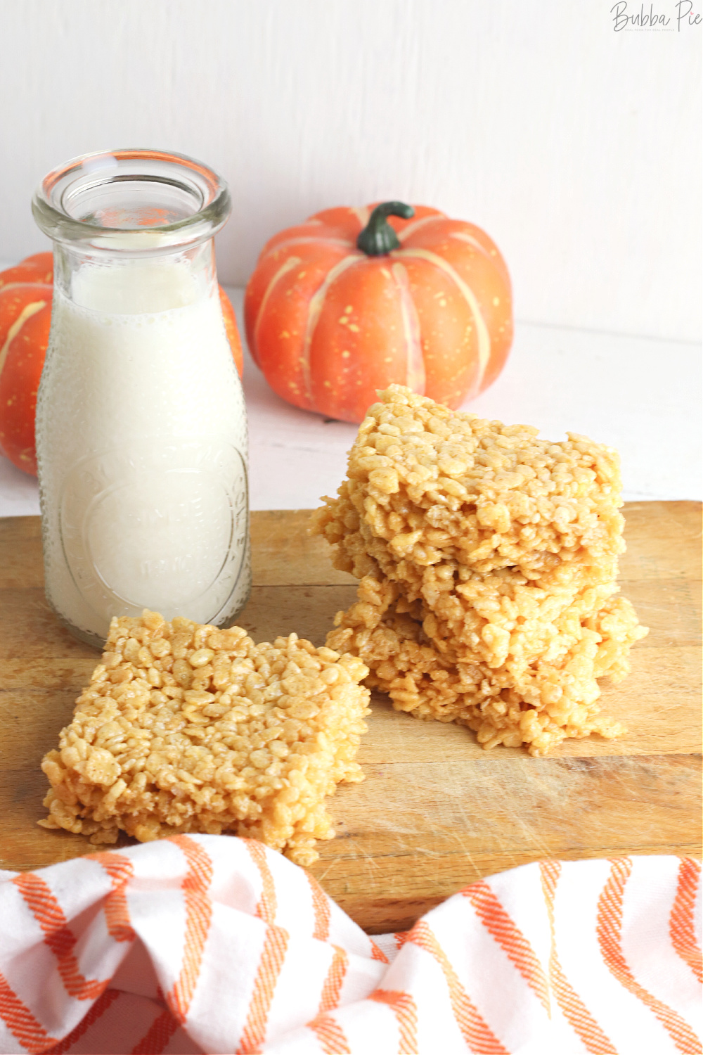 Pumpkin Flavored Rice Krispie Treats on a table with Fall Decorations