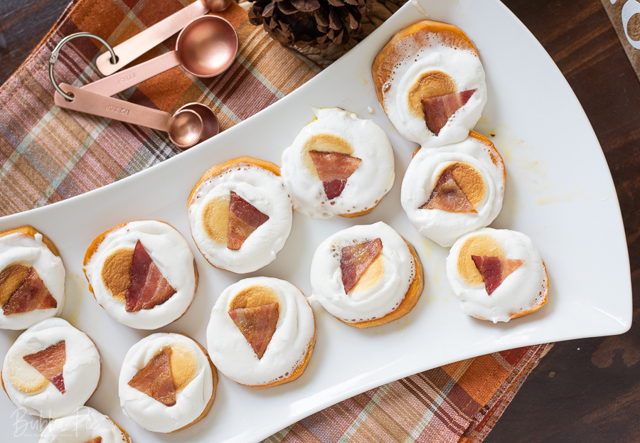 Sweet Potato Bites being served on a table with Thanksgiving decorations.