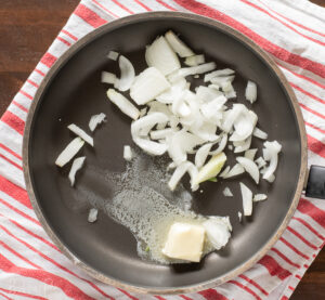 melt butter in medium sized saucepan and add diced onions.