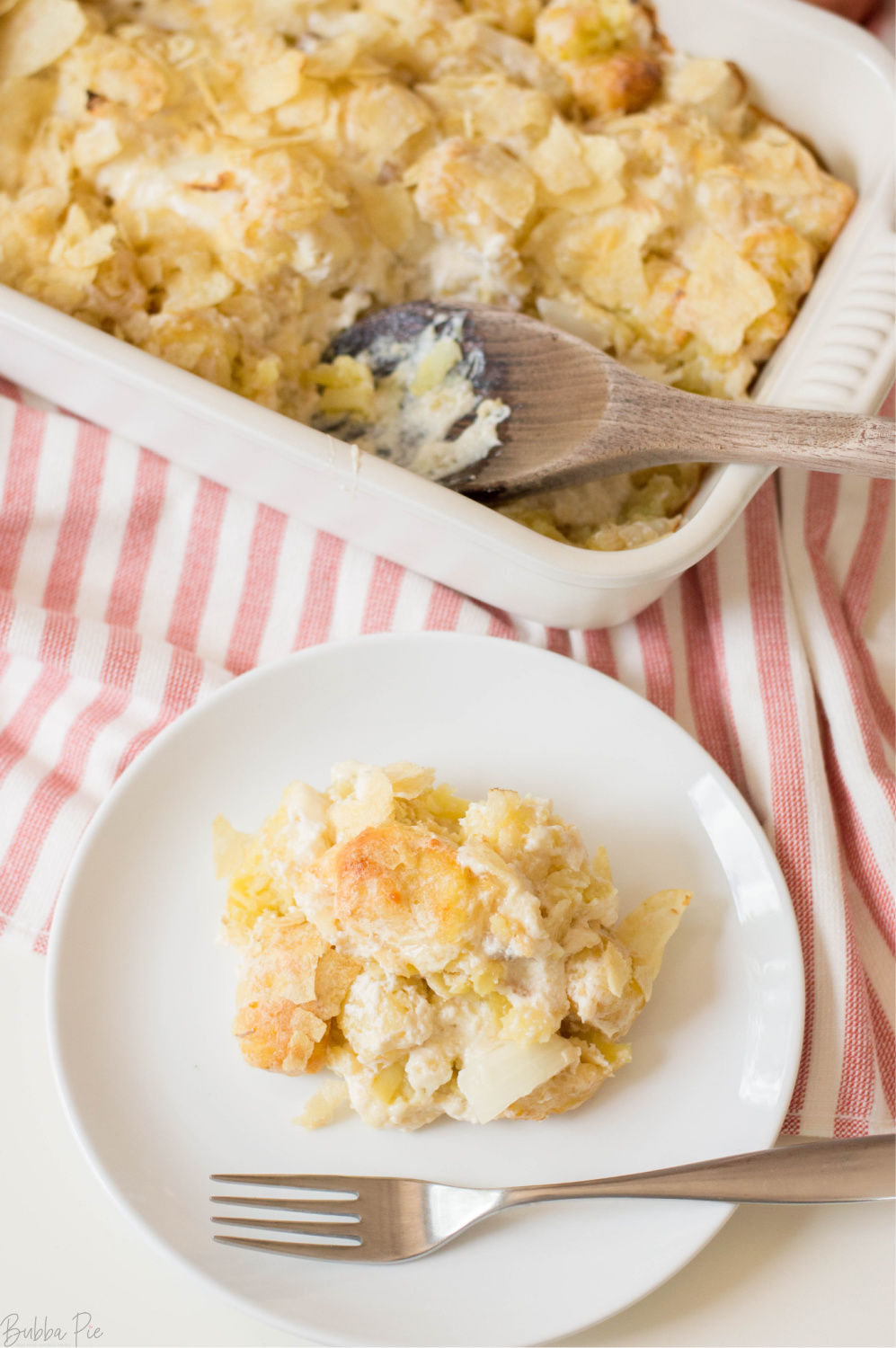 Cheesy Potato Casserole being served on a plate.