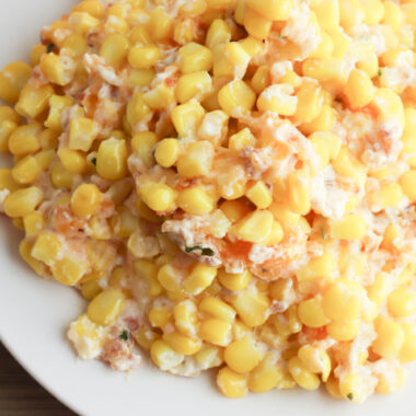 Corn Casserole with Cream Cheese being served on a white plate.