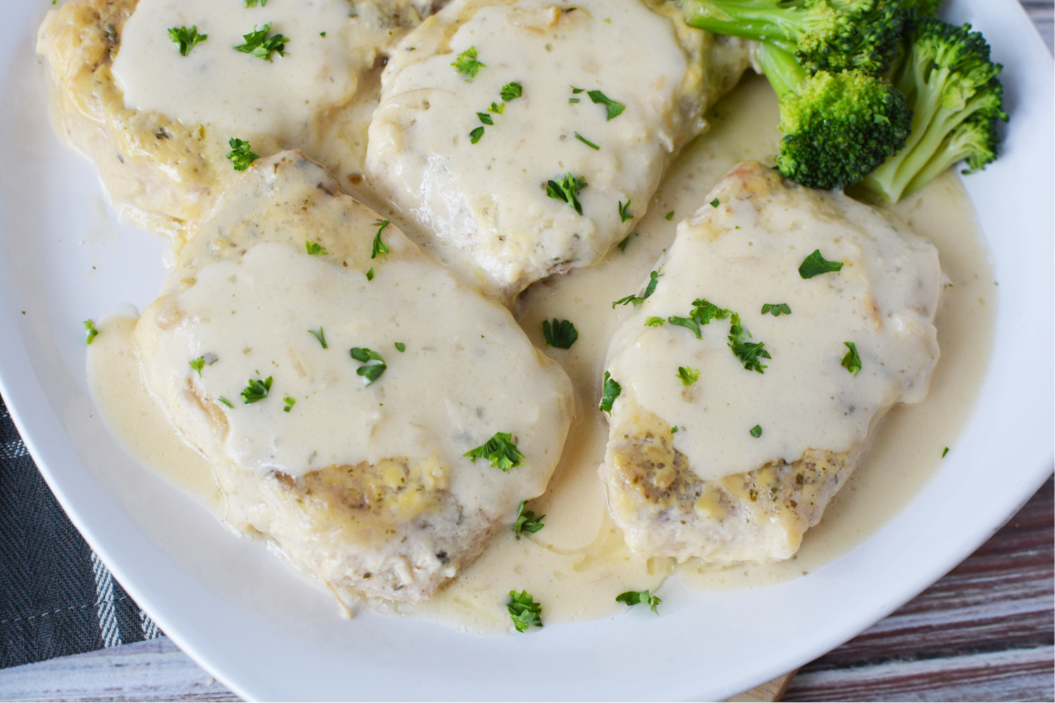 Crockpot Ranch Pork Chops being served as a family dinner. 